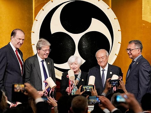 From left: World Bank Group President David Malpass, Commissioner for the Economy of the European Commission Paolo Gentiloni, US Treasury Secretary Janet Yellen, Japanese Finance Minister Shunichi Suzuki, and Joachim Nagel, president of the Deutsche Bundesbank, break sake barrels during the welcoming reception of the G7 meeting of Finance Ministers and Central Bank Governors at Toki Messe in Niigata on May 11, 2023. 