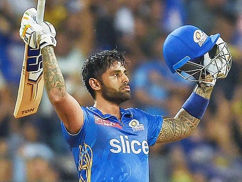 Mumbai Indians' Suryakumar Yadav celebrates after scoring a century during the IPL match against Gujarat Titans at the Wankhede Stadium in Mumbai on May 12, 2023. 