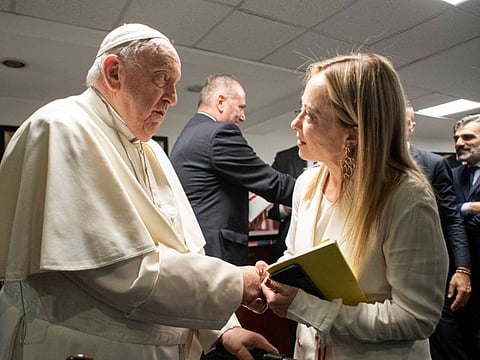 Pope Francis with Italy's Prime Minister Giorgia Meloni at a national confront on demographics in Rome, on May 12, 2023.  