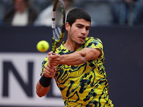 Spain's Carlos Alcaraz in action during his round of 64 match against Spain's Albert Ramos-Vinolas .