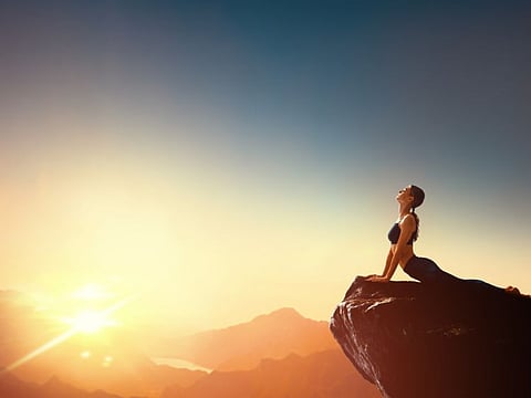 Woman practising yoga and meditation.