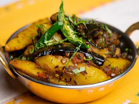 Aloo Baigan Sukha or Indian-style potato and aubergine fry