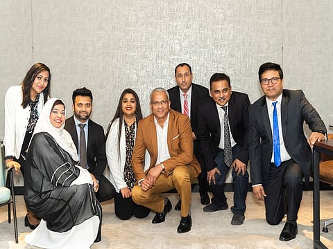 Pradeep Kumar, General Manager, ABCOM Distribution LLC, with Abcom Team