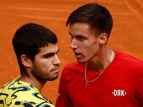 Hungary's Fabian Marozsan (right) with Spain's Carlos Alcaraz,  after winning his round of 32 match.