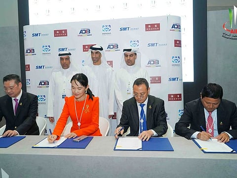 Annual Investors Meeting President Dawood Al Shezawi ( Back Left) and  Dr. Thani bin Ahmed Al Zeyoudi, Minister of State for Foreign Trade (Back middle), Dr. Mengsha Tan (Front left middle) Yu Sun (Front right middle), Rish Cheung (left front), Huang Shaowu (front right)