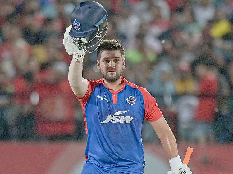 Delhi Capitals' Rilee Rossouw celebrates scoring a half century