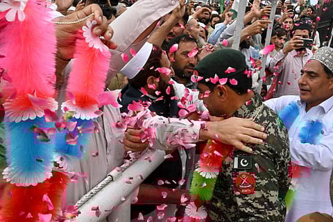 People take part in a rally to show solidarity with Pakistan's army in Peshawar on May 17, 2023, after military installations were allegedly damaged by supporters of former Pakistan's prime minister Imran Khan following his arrest last week.  