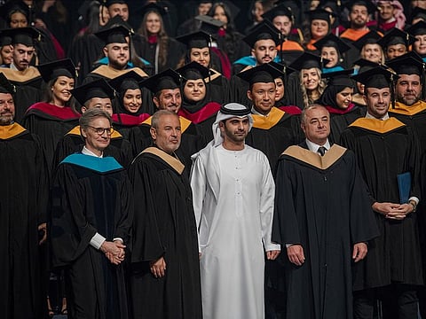 Shaikh Mansoor Bin Mohammad bin Rashid Al Maktoum, Chairman of Dubai Sports Council, Founder and Creative Director of Elie Saab Group, Elie Saab, AUD President, Dr. David A. Schmidt with graduates of 2023.