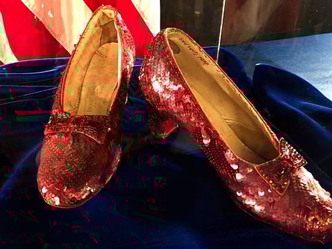 File photo of the pair of ruby slippers once worn by actress Judy Garland in the 'The Wizard of Oz" sit on display at a news conference on Sept. 4, 2018, at the FBI office in Brooklyn Center, Minn. Federal prosecutors say a man has been indicted by a grand jury on Tuesday, May 16, 2023, on charges of stealing a pair of ruby red slippers worn by Judy Garland in 'The Wizard of Oz' (1939).