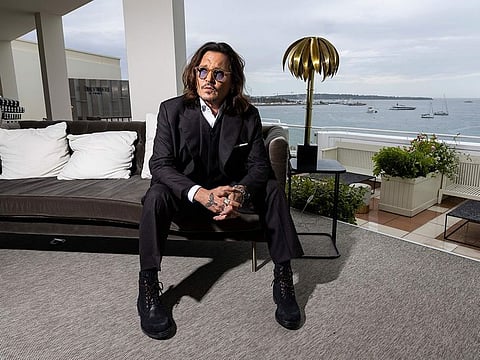 Johnny Depp poses for portrait photographs for the film 'Jeanne du Barry' at Cannes. 