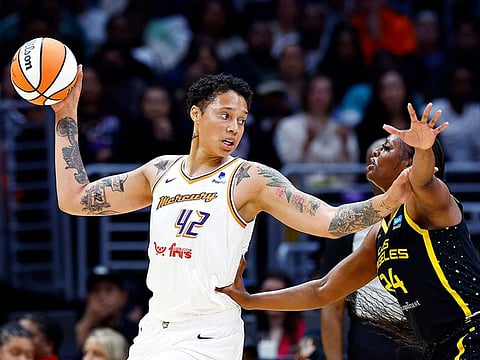 Brittney Griner #42 of the Phoenix Mercury controls the ball against Joyner Holmes #24 of the Los Angeles Sparks in the first half at Crypto.com Arena on May 19, 2023 in Los Angeles, California.  