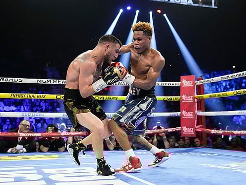 Devin Haney, right, fights Vasiliy Lomachenko in an undisputed lightweight championship boxing match in Las Vegas.