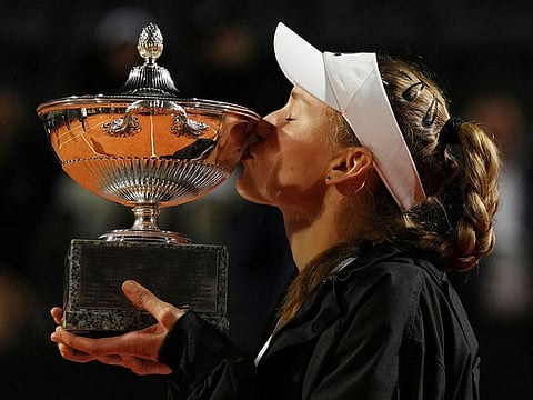 Kazakhstan's Elena Rybakina celebrates with the Italian Open trophy after winning her final match against Ukraine's Anhelina Kalinina.