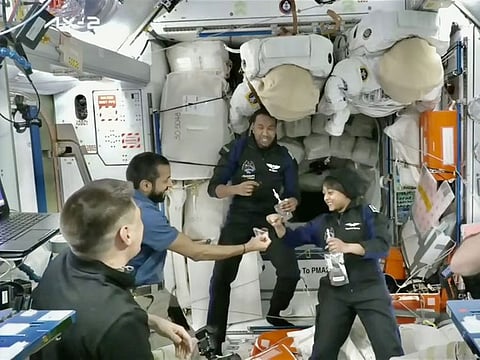 Al Neyadi (second from left) welcomes the Saudi crew members 