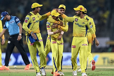 Chennai Super Kings' players celebrate after the dismissal of Gujarat Titans' Darshan Nalkande (not pictured) during the Indian Premier League (IPL) Twenty20 first qualifier cricket match at the MA Chidambaram Stadium in Chennai. Chennai won by 15 runs.