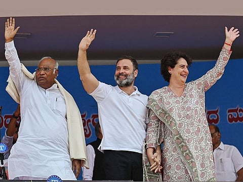 Congress President Mallikarjun Kharge with party leaders Rahul Gandhi and Priyanka Gandhi Vadra during the oath taking ceremony of the newly-elected Karnataka Government, at Kanteerava Stadium in Bengaluru