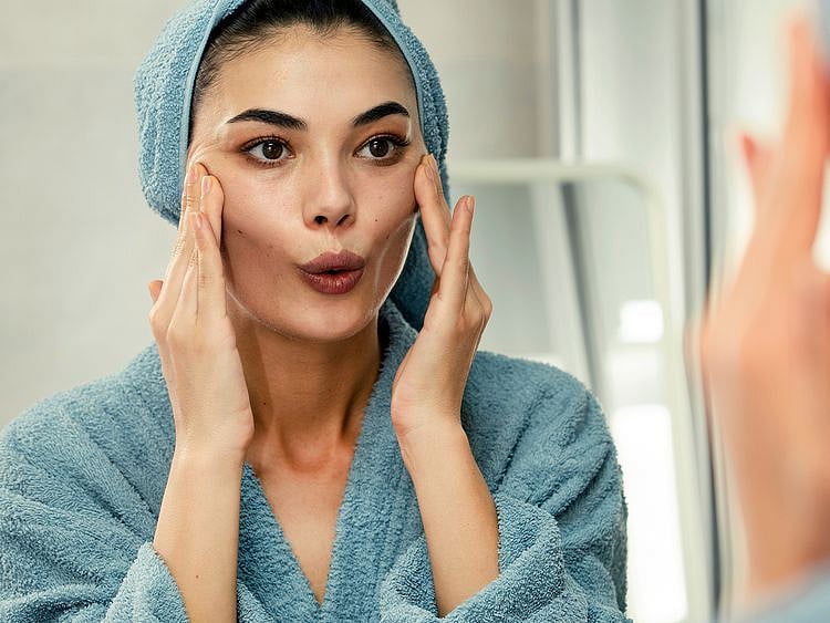 person doing facial exercises 