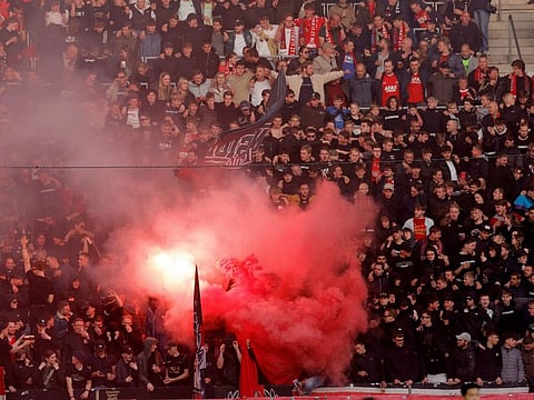 AZ Alkmaar fans with flares.