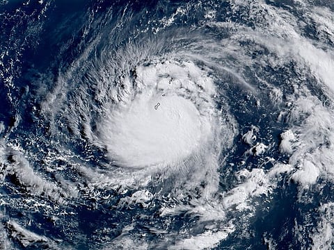 This satellite image obtained from the The National Oceanic and Atmospheric Administration shows Typhoon Mawar, as it approached Guam. 