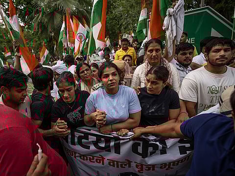  India's top female wrestlers and their supporters march towards landmark India Gate monument protesting against Wrestling Federation of India President Brijbhushan Sharan Singh in New Delhi, India, Tuesday, May, 23, 2023. 