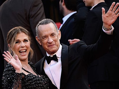 US actor Tom Hanks arrives with wife, US actress Rita Wilson, for the screening of the film 'Asteroid City' during the 76th edition of the Cannes Film Festival in Cannes, southern France, on May 23, 2023.