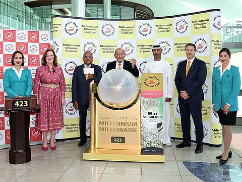Dubai Duty Free representatives showing the winning ticket picked at the draw on Wednesday at the airport