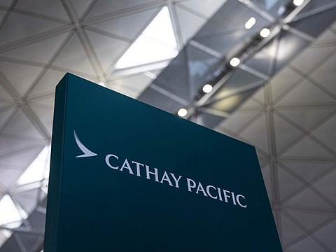 The passenger on CX987 on Sunday wrote that flight attendants complained about passengers amongst themselves in English and Cantonese.