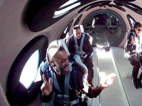 Mission specialist Christopher Huie, left, instructor Luke Mays, center, and mission specialist Jamila Gilbert during a Virgin Galactic spaceflight test on Thursday, May 25, 2023. 