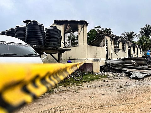 The school dormitory that caught fire and left at least 19 people dead in Mahdia, Guyana.