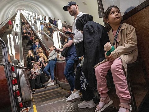 People take cover at metro station during a Russian rocket attack in Kyiv, Ukraine, Monday, May 29, 2023.