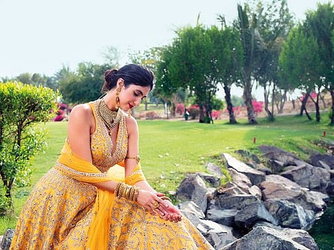 Outfit Raw silk mirror work lehenga and blouse set (with dupatta) Dh4,303, Frontier Raas - Dubai, @frontierraasdubai  Jewellery Kundan choker, earrings, bangles, arm band and rings in 22K gold with antique finish all by Kanz Jewels