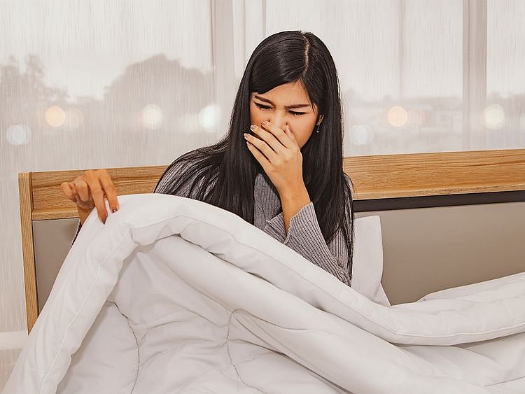 Woman upset with her bedsheets