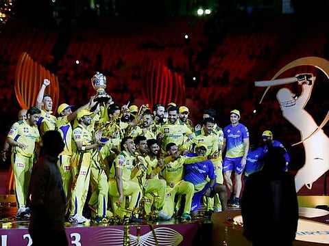 File photo: Chennai Super Kings' players pose with the IPL trophy in celebration as CSK beat Gujarat Titans by 5 wickets during the final of Indian Premier League 2023, at Narendra Modi Stadium, in Ahmedabad. 
