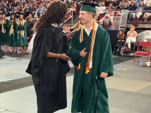 Nobel Haskell walking on stage to receive his degree