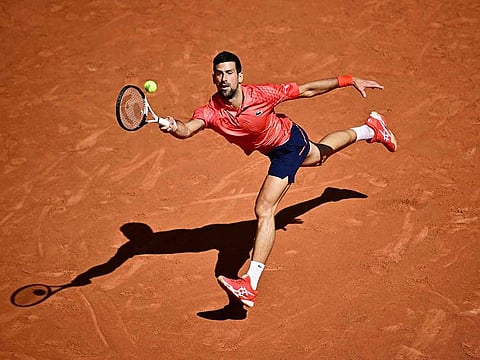 Serbia's Novak Djokovic plays a forehand return to Spain's Alejandro Davidovich Fokina during their men's singles match on day six of the French Open tennis tournament at the Court Philippe-Chatrier in Paris on June 2, 2023. 