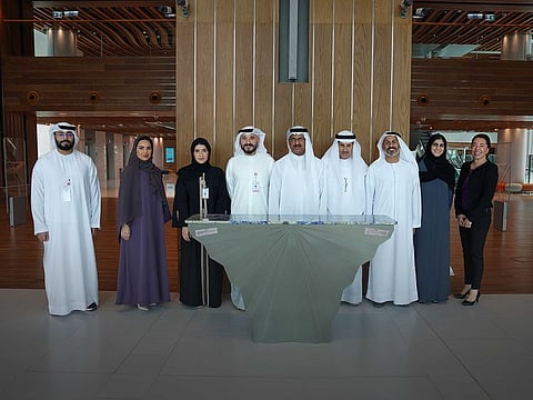 Amer Khansaheb, Managing Director at Khansaheb Group (3rd from Right), Samr Husain Al Marzooqi, Director of Events and Communications Department at Mohammed Bin Rashid Library (4th From Left), Dr. Mazna Ahmad Abdulrahim Mahmood Hafiz, Director of Corporate Support Department (3rd from Left), Amal Alblooshi, Head of Marketing and Communication, Events & Communication Department (2nd from Left), and officials of Khansaheb Group seen with the Niki Console.