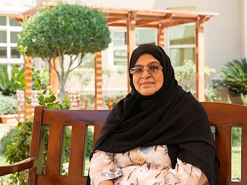 Mama Khatoun, an Emirati mum and former police officer, with medical caregivers who helped her get back on her feet.