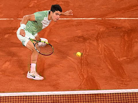 Spain's Carlos Alcaraz Garfia plays a backhand return to Greece's Stefanos Tsitsipas during their men's singles quarter-final match at the Court Philippe-Chatrier in Paris on Tuesday.
