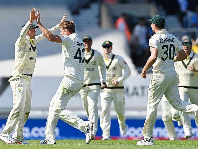 Australia's Cameron Green (2L) celebrates taking the wicket of India's Cheteshwar Pujara