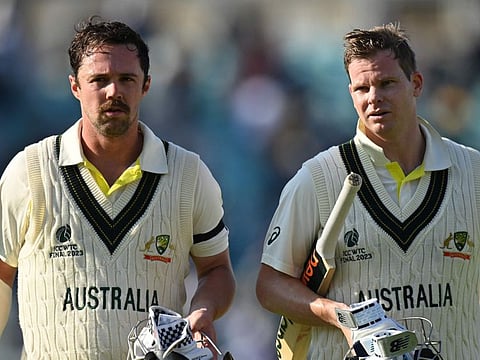 Australia's Travis Head and Steve Smith walk back to the pavilion after the end of play during day 1.