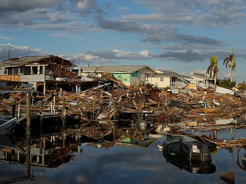 Cars and debris from washed away homes line a canal in Fort Myers Beach, Florida on October 5, 2022, one week after the passage of Hurricane Ian. After months of gradually warming sea surface temperatures in the tropical Pacific Ocean, NOAA officially issued an El Nino advisory on June 8, 2023, and stated that this one might be different than the others. 