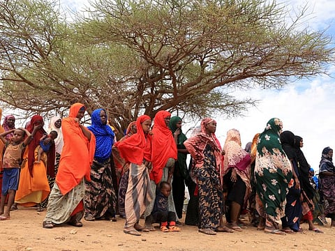 Internally displaced Ethiopians queue to receive food aid in the Higlo camp for people displaced by drought in the town of Gode, Somali Region, Ethiopia,  