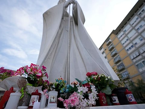 A statue of Saint John Paul II towers at the entrance of the Agostino Gemelli University Polyclinic in Rome on June 9, 2023, where Pope Francis is recovering after undergoing abdominal surgery on Wednesday.  
