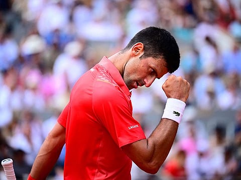 Serbia's Novak Djokovic celebrates a point against Norway's Casper Ruud during their men's singles final match on day fifteen of the Roland-Garros Open tennis tournament at the Court Philippe-Chatrier in Paris.