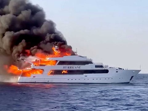 Plumes of smoke erupt from a yacht on fire in Marsa Alam, Egypt, June 11, 2023 in this screengrab taken from a handout video. 