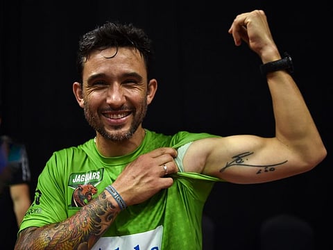 Sanyo Gutierrez of Jaguars shows his tattoo that has Messi's autograph during the World Padel League at Coca Cola Arena on Sunday.