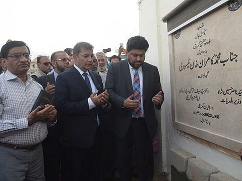 Sindh Governor, Kamran Khan Tessori, along with Karachi Administrator, Dr Syed Saif-ur-Rehman, pray after performing groundbreaking of new City Council Hall in Karachi. 