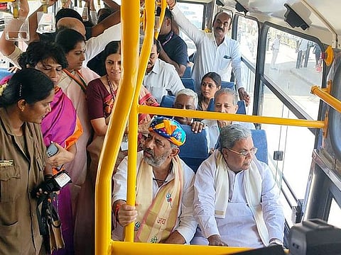 Karnataka Deputy Chief Minister DK Shivakumar interacts with a woman conductor as he travels in a bus with State CM Siddaramaiah during the inauguration of free travel for women in KSRTC and BMTC buses under 'Shakti Yojana', in Bengaluru on Sunday, June 11, 2023.