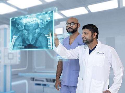 Dr Assad Qureshi (right) conducted the five-hour surgery, assisted by Dr Jubin Raj