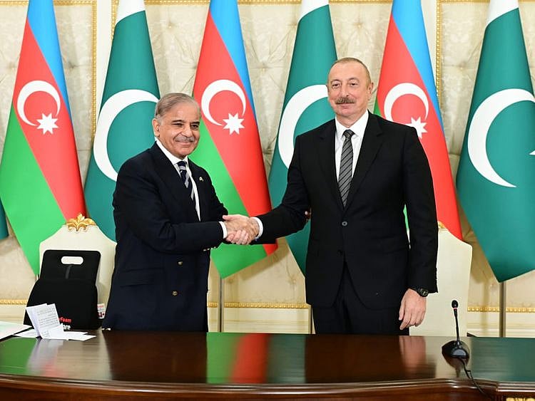 Pakistan Prime Minister Shehbaz Sharif and President of Azerbaijan Ilham Aliyev shake hands during a meeting in Baku on June 15, 2023. 